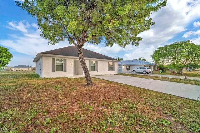 a house with trees in the background