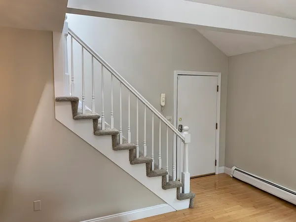 a view of entryway with wooden floor