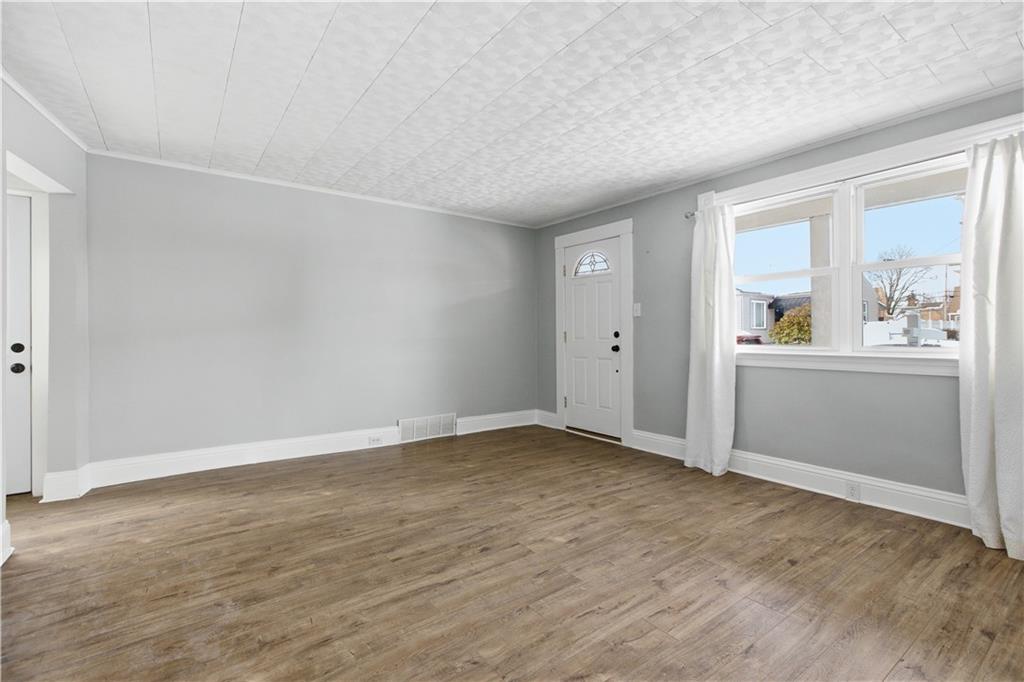 208 Boden Avenue Carnegie, PA 15106 - Photo 17 of 26 wooden floor in an empty room