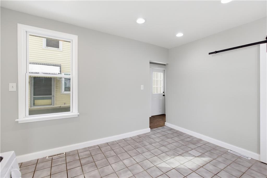 208 Boden Avenue Carnegie, PA 15106 - Photo 8 of 26 a view of an empty room and window