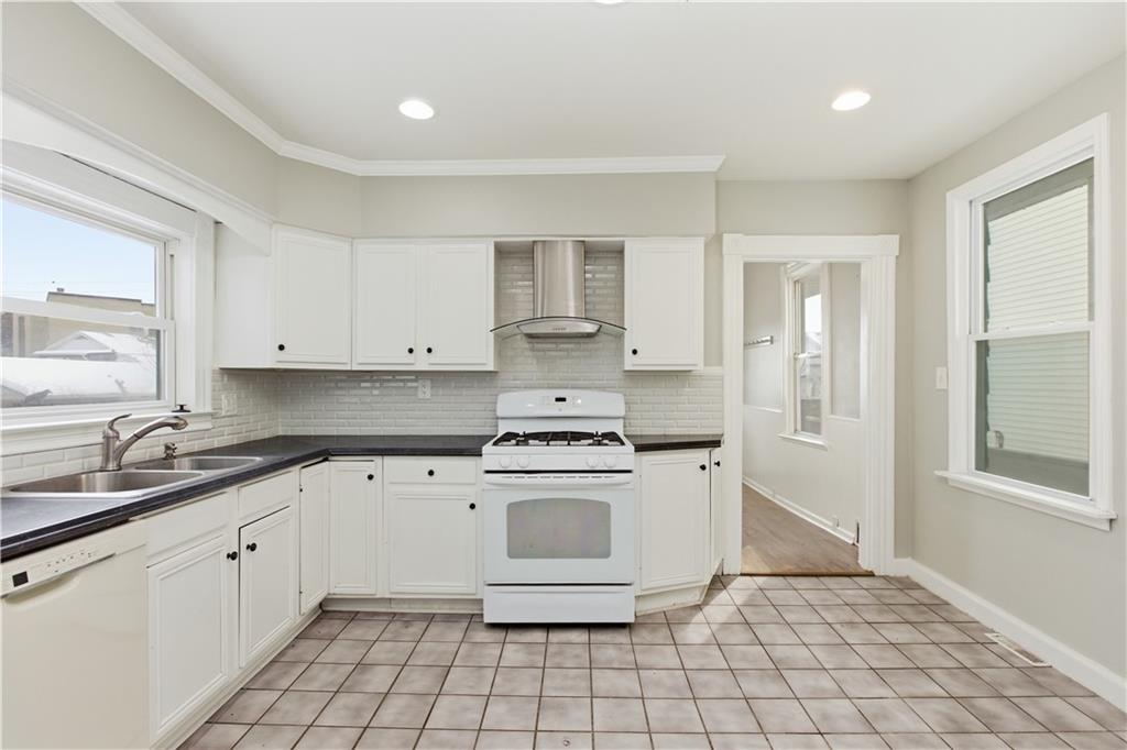 208 Boden Avenue Carnegie, PA 15106 - Photo 10 of 26 a stove top oven sitting inside of a kitchen