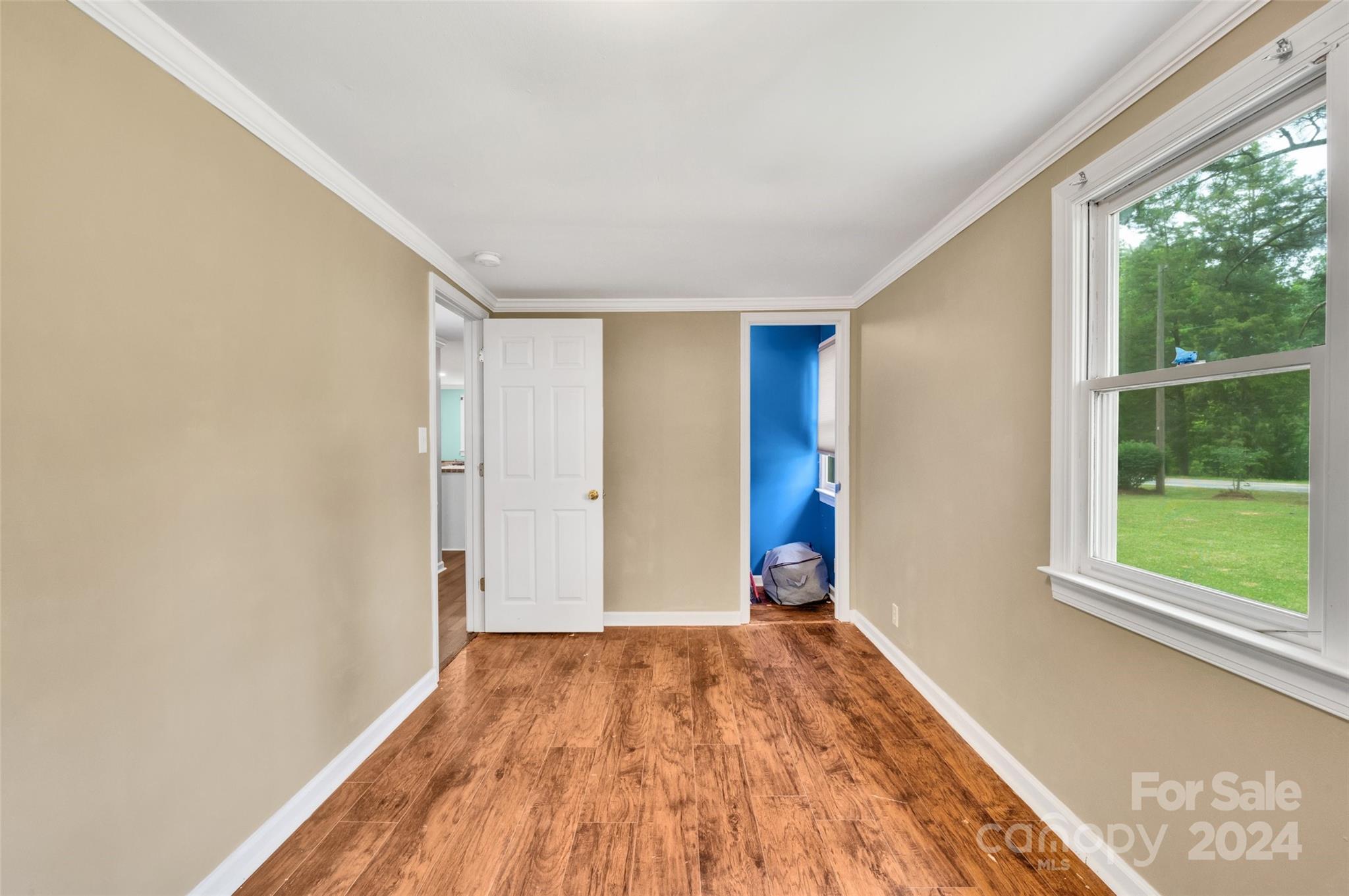 2670 Holbrook Road Fort Mill, SC 29715 - Photo 13 of 26 a view of empty room with wooden floor and fan
