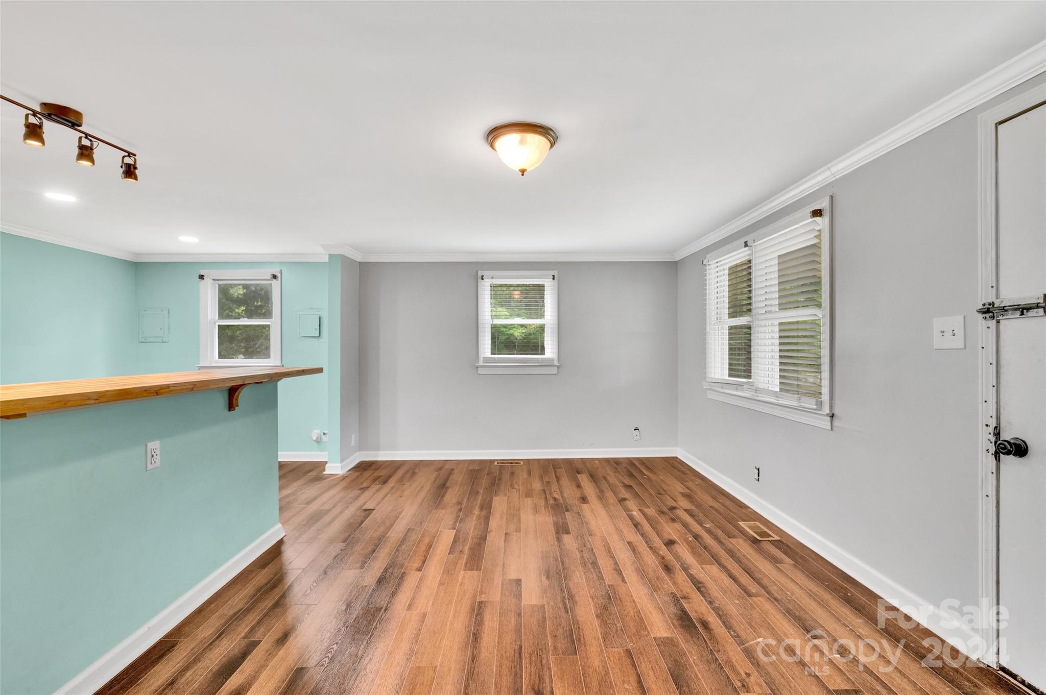 2670 Holbrook Road Fort Mill, SC 29715 - Photo 8 of 26 a view of empty room with wooden floor and fan