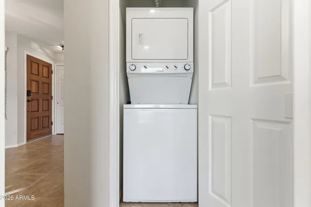 a close view of a utility room with dryer and washer