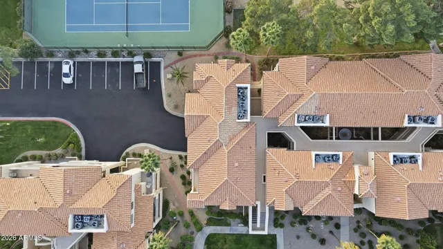 an aerial view of a house with a yard