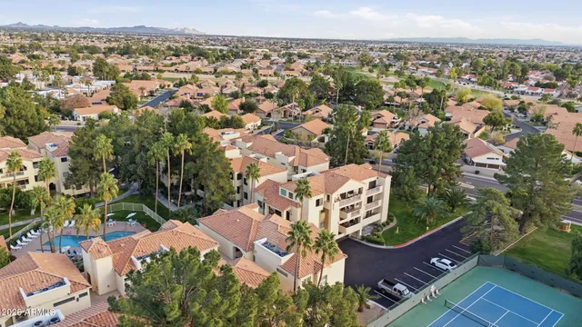an aerial view of a house with a lake view