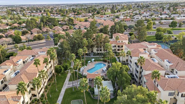 an aerial view of residential houses with outdoor space