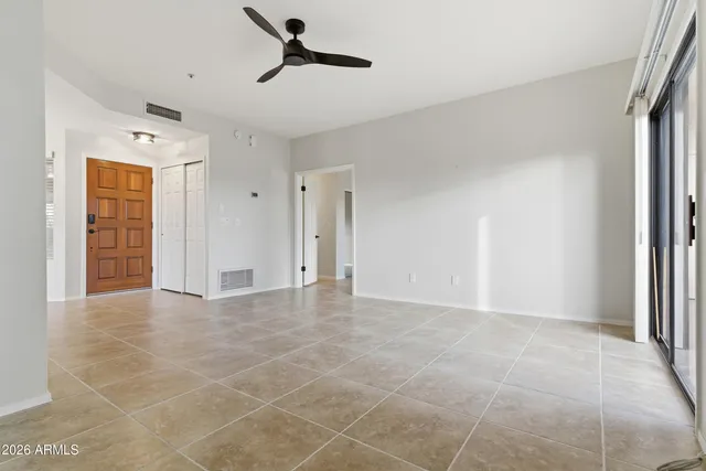 a view of an empty room with a window