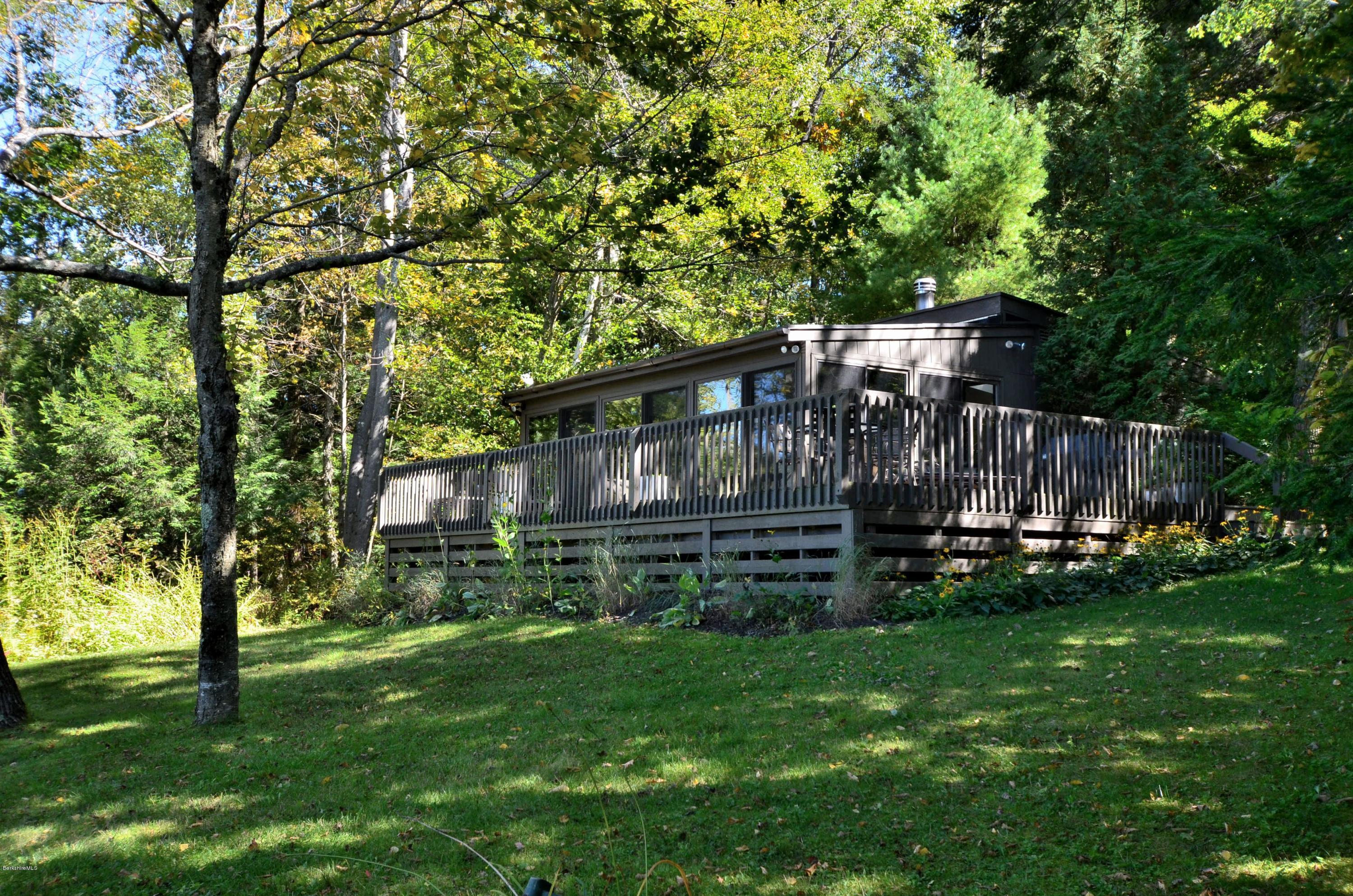 16 Point Road Monterey, MA 01245 - Photo 2 of 18 a backyard of a house with lots of green space