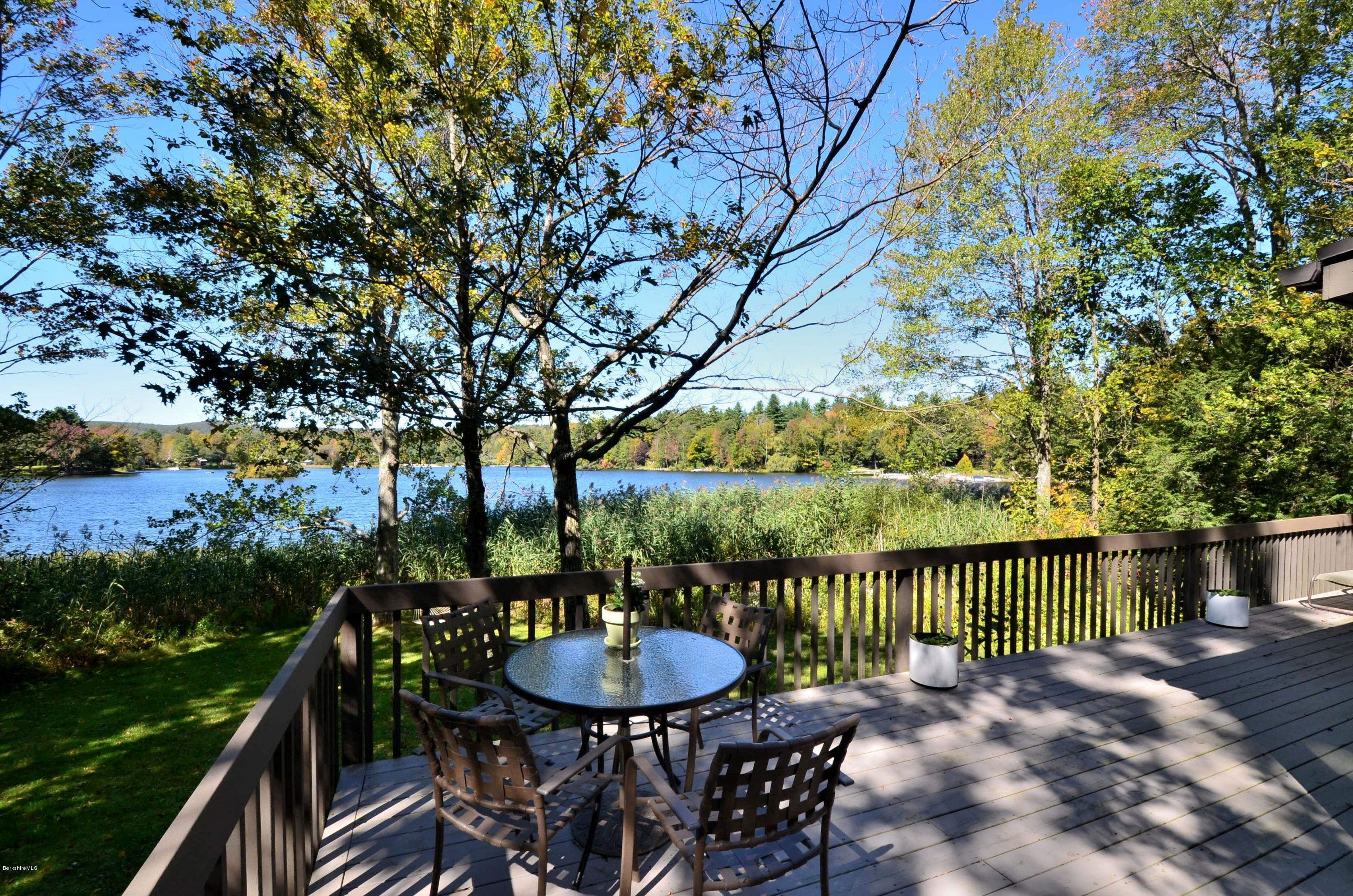 16 Point Road Monterey, MA 01245 - Photo 6 of 18 a view of a table and chairs on the roof deck
