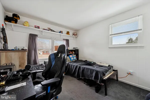a bedroom with furniture and a closet