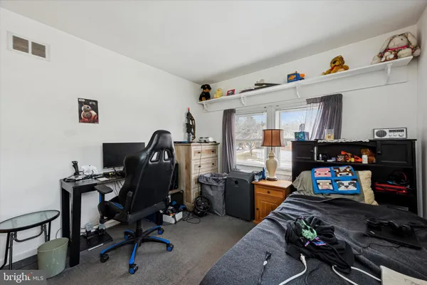 a view of a workspace with furniture and toys