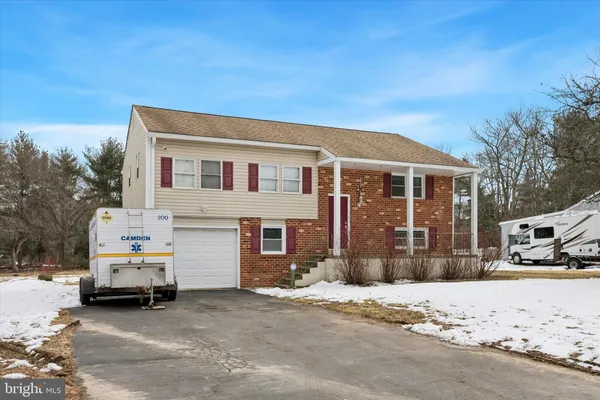 a view of a house with a large space in front of a house