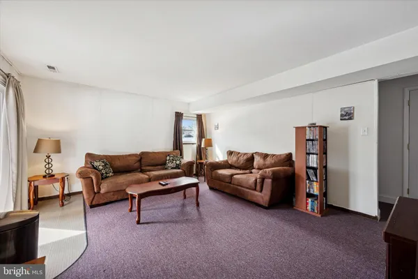 a living room with furniture and a couch