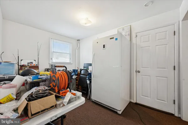 a bed room with furniture and a window