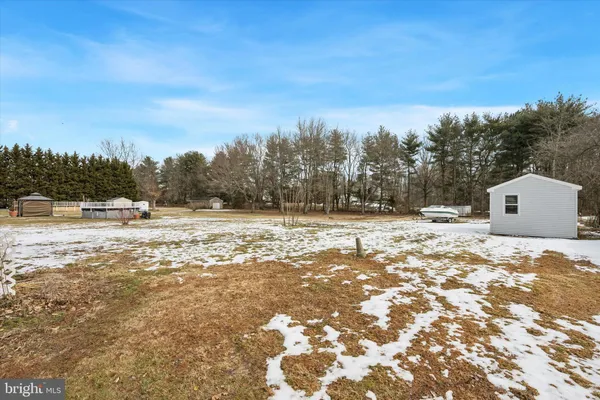 a view of swimming pool with a yard