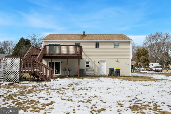 a view of a house with a snow in the yard