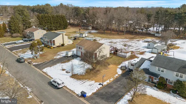 an aerial view of a house with a yard swimming pool and mountain view