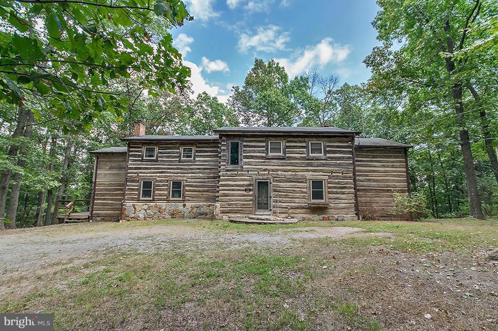 1209 Libby's Ridge Road Berkeley Springs, WV 25411 - Photo 2 of 30 a view of house with backyard