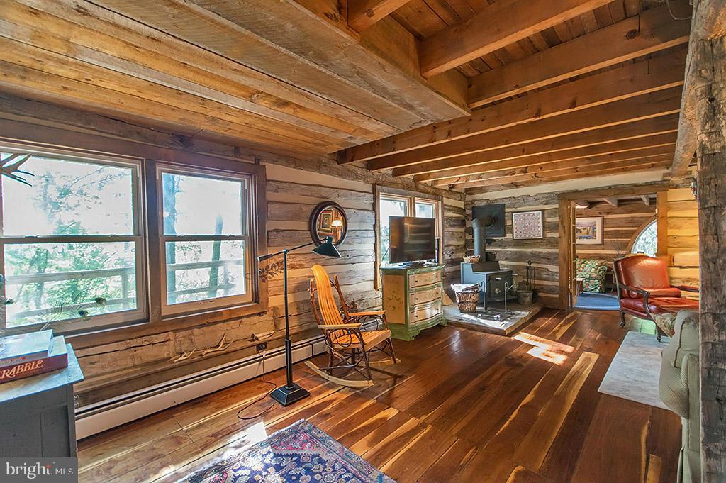 1209 Libby's Ridge Road Berkeley Springs, WV 25411 - Photo 7 of 30 a view of a room with wooden floor