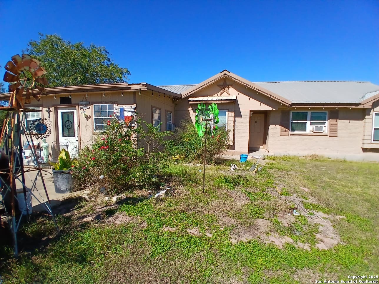 706 Thomaston River Road Cuero, TX 77954 - Photo 2 of 46 a front view of house with yard and green space
