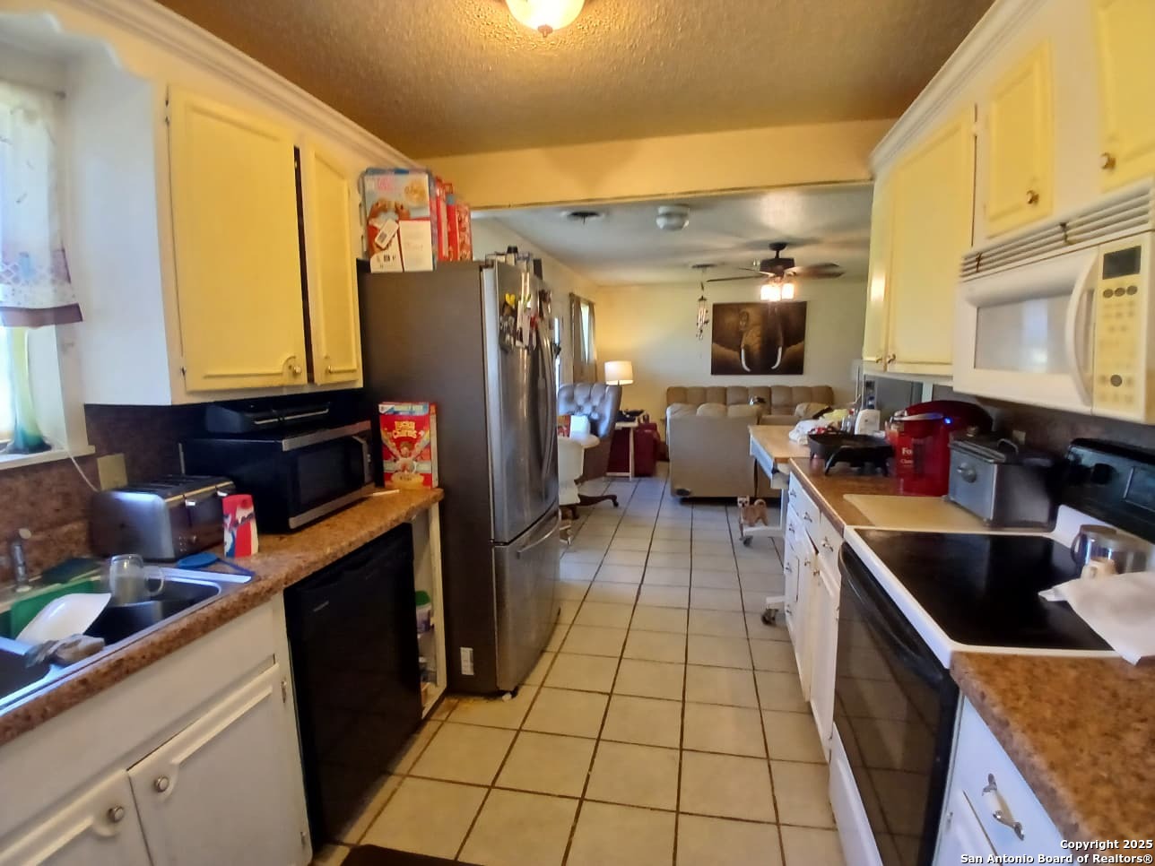 706 Thomaston River Road Cuero, TX 77954 - Photo 23 of 46 a kitchen with stainless steel appliances granite countertop a sink and cabinets