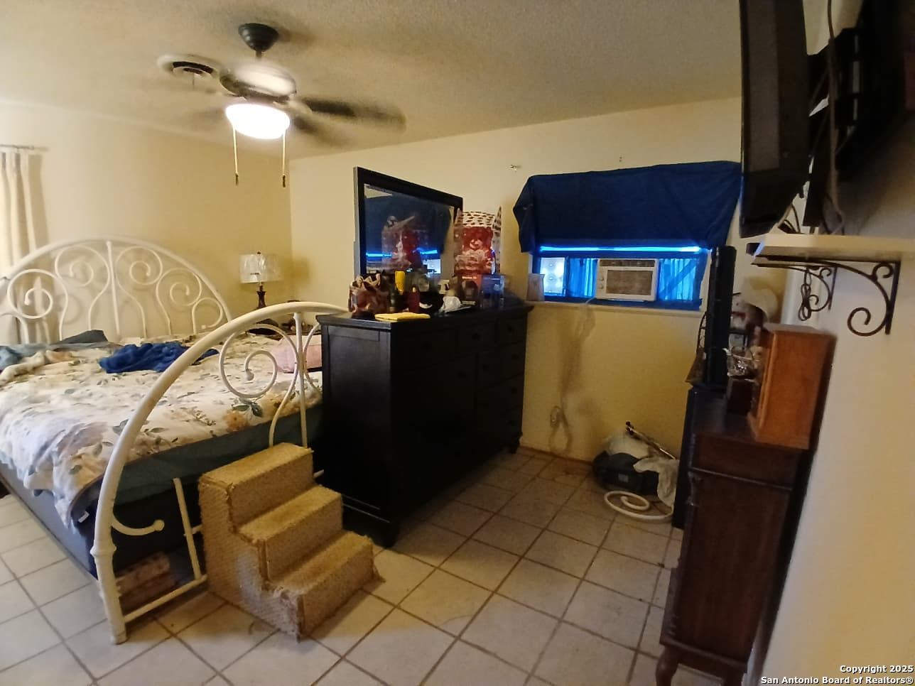 706 Thomaston River Road Cuero, TX 77954 - Photo 38 of 46 a bedroom with furniture and a flat screen tv