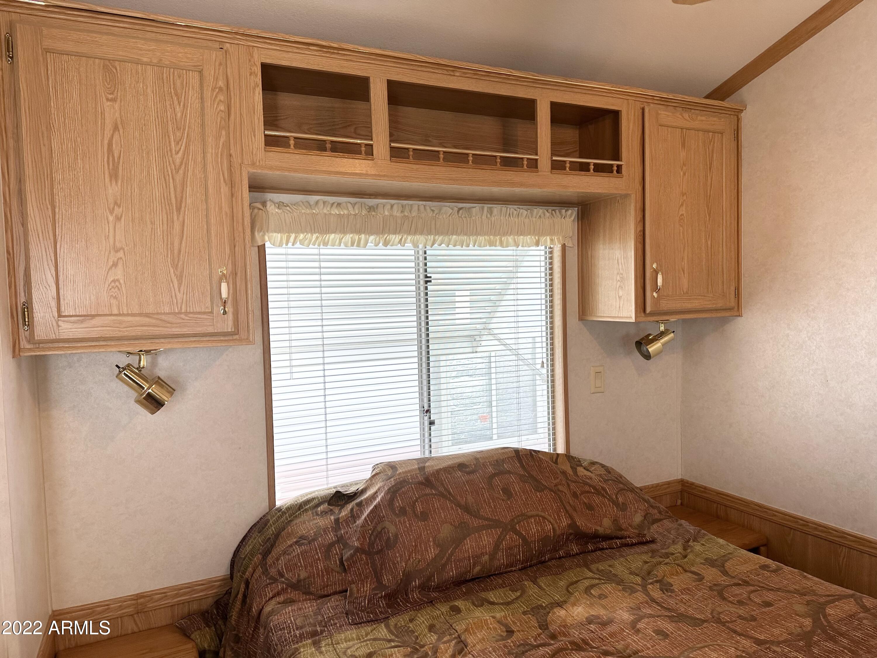 997 South Prospectors Road Apache Junction, AZ 85119 - Photo 42 of 63 CABINETS ABOVE BED