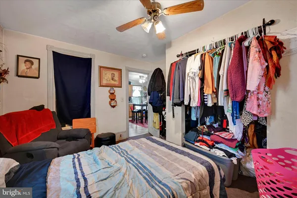 a bed room with a bed and a walk in closet