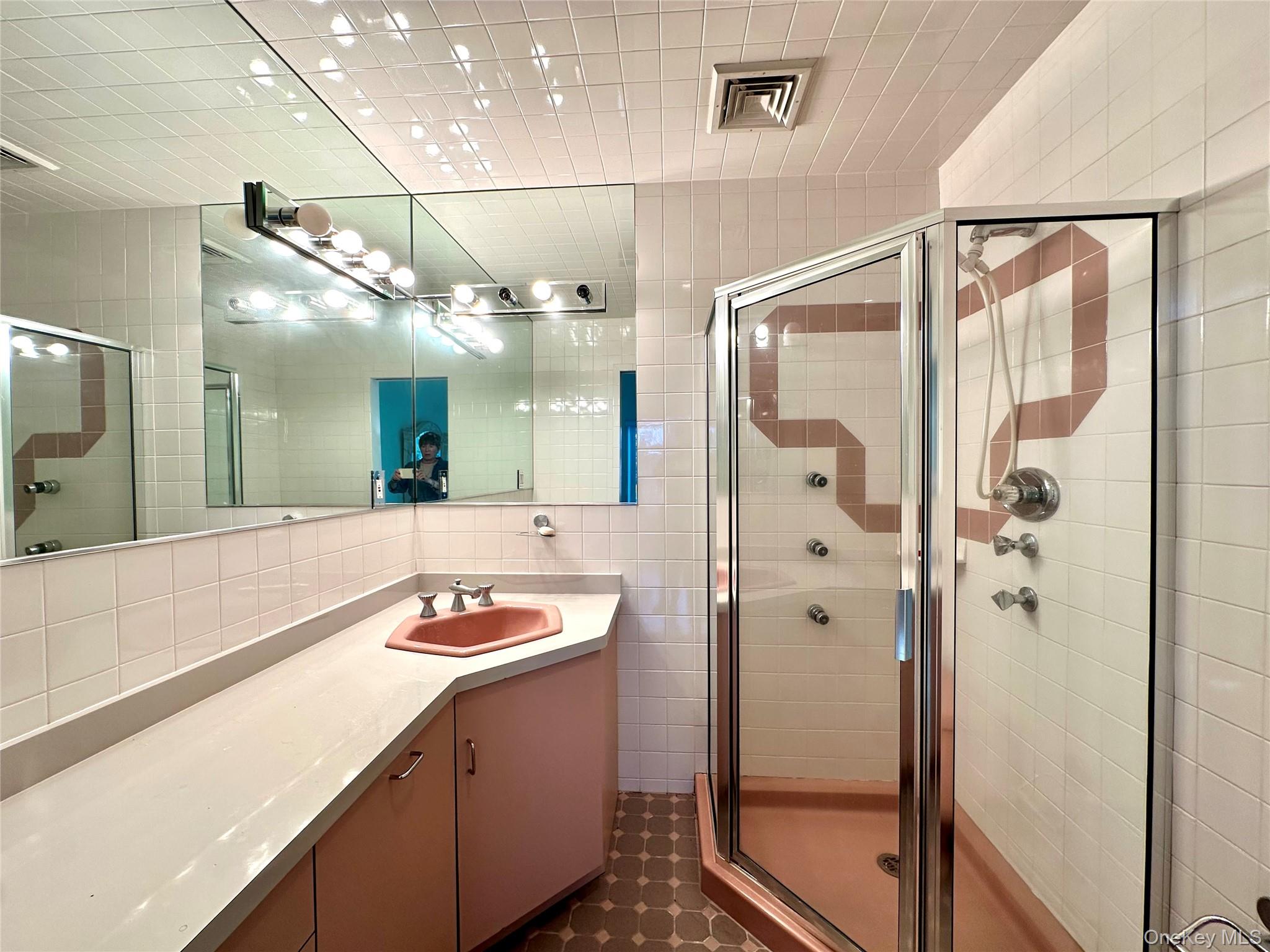 1027 Windermere Road Franklin Square, NY 11010 - Photo 16 of 43 a bathroom with a granite countertop sink a shower and a mirror