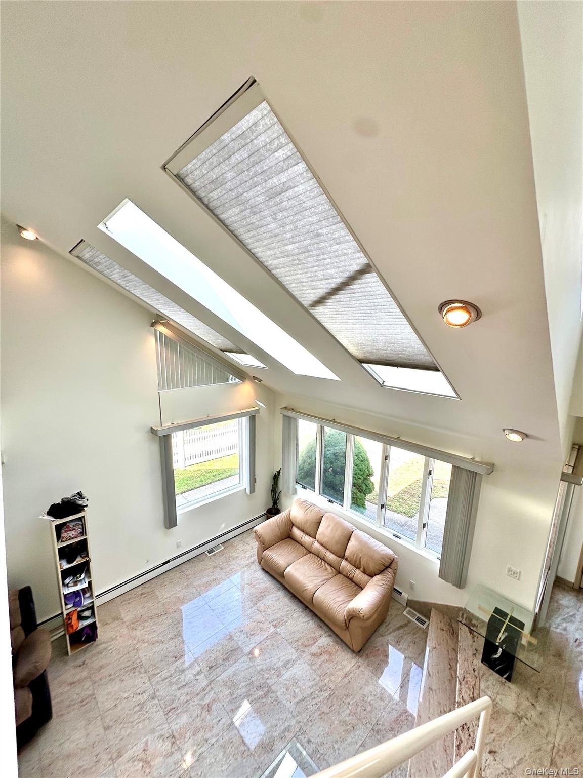1027 Windermere Road Franklin Square, NY 11010 - Photo 20 of 43 a living room with furniture and a window