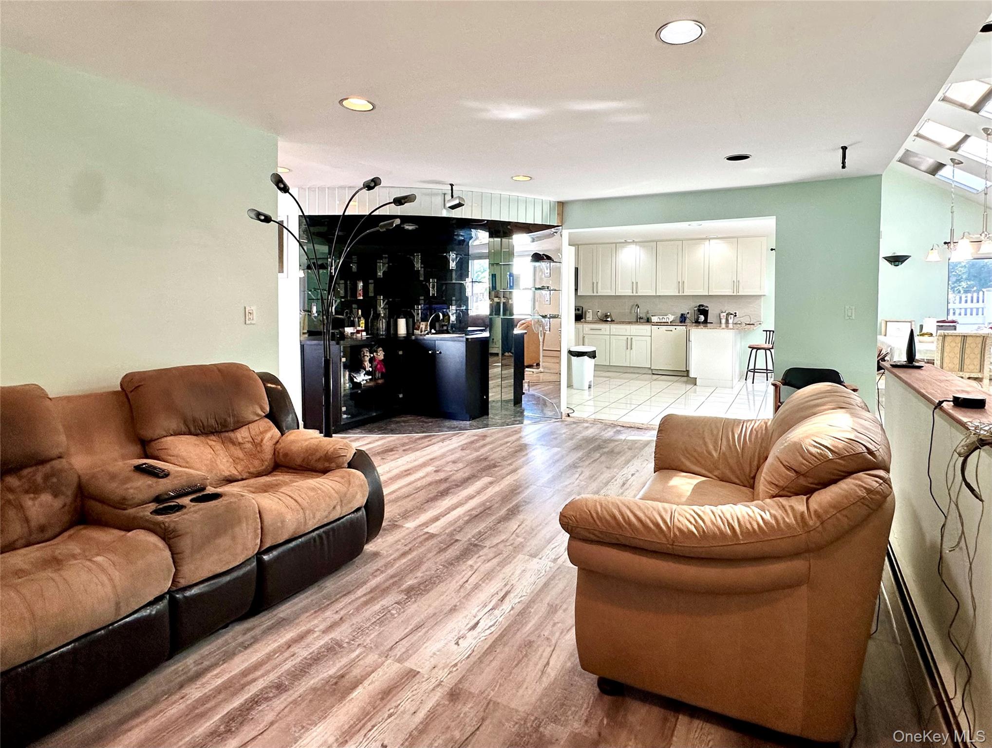 1027 Windermere Road Franklin Square, NY 11010 - Photo 25 of 43 a living room with furniture and a wooden floor