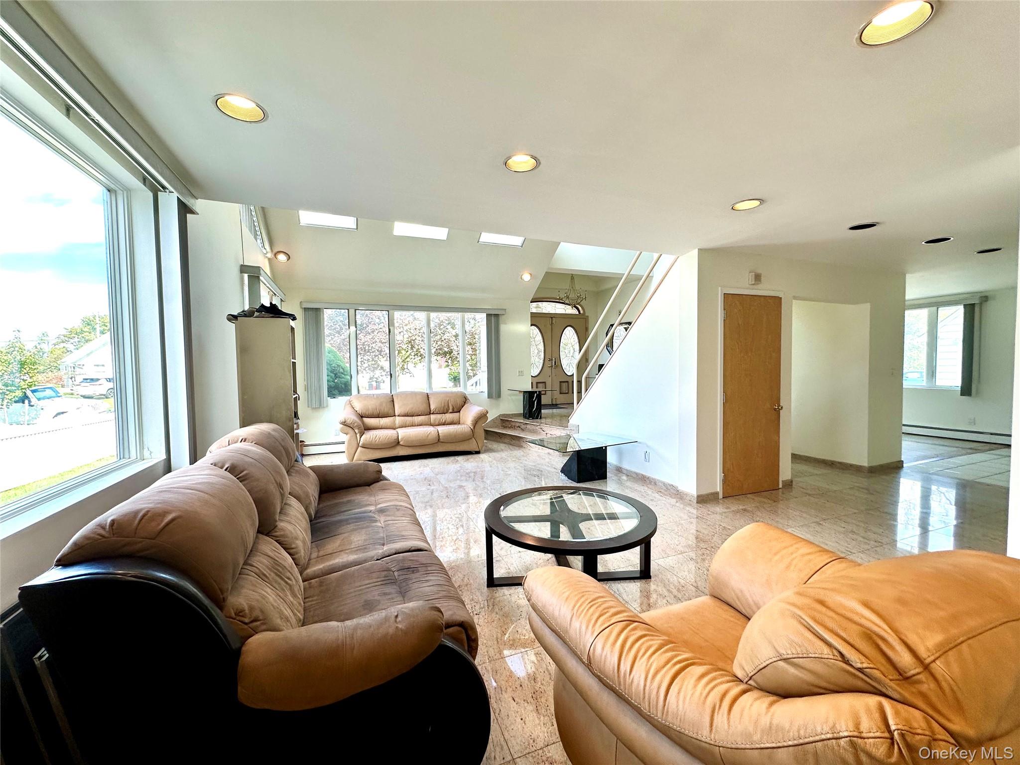 1027 Windermere Road Franklin Square, NY 11010 - Photo 28 of 43 a living room with furniture and a large window