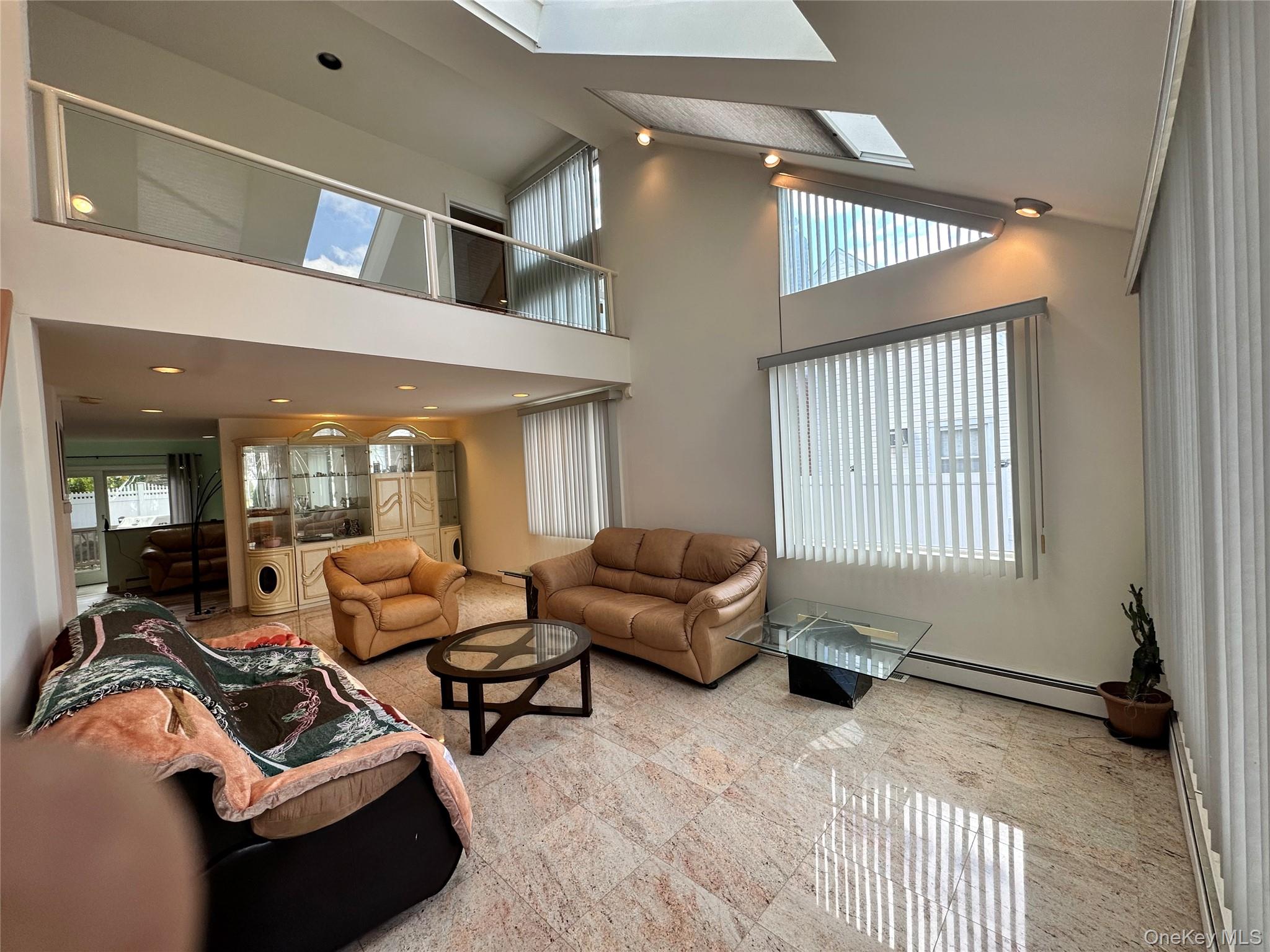 1027 Windermere Road Franklin Square, NY 11010 - Photo 3 of 43 a living room with furniture and a window