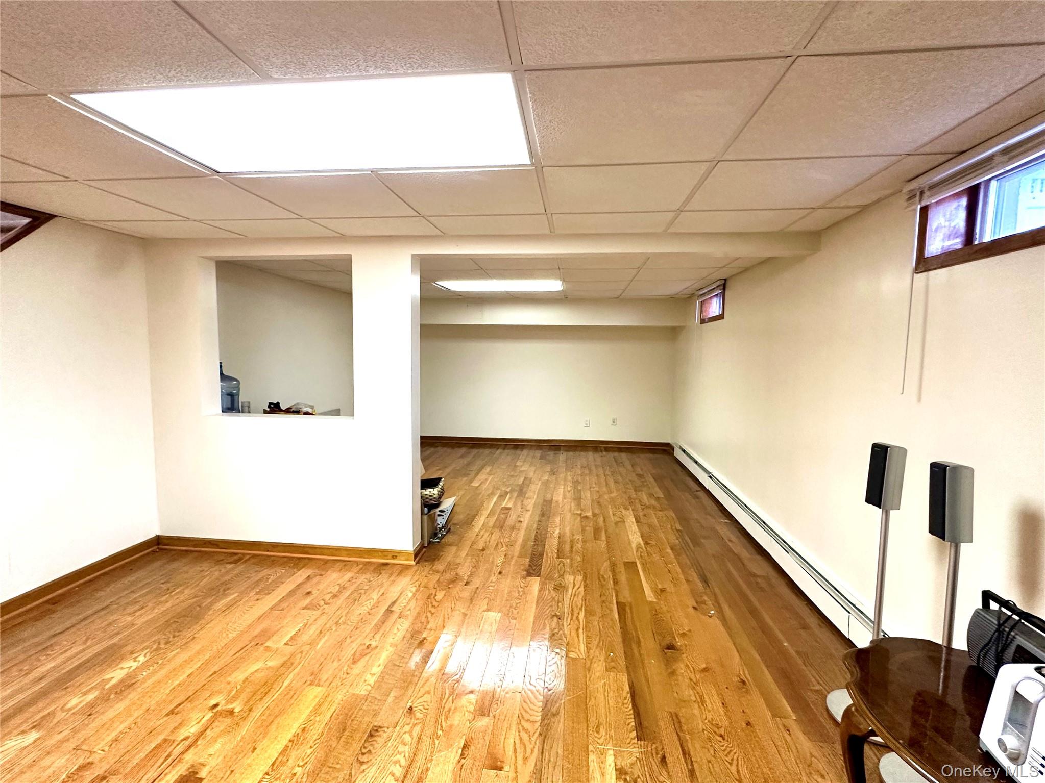 1027 Windermere Road Franklin Square, NY 11010 - Photo 31 of 43 a view of empty room with wooden floor