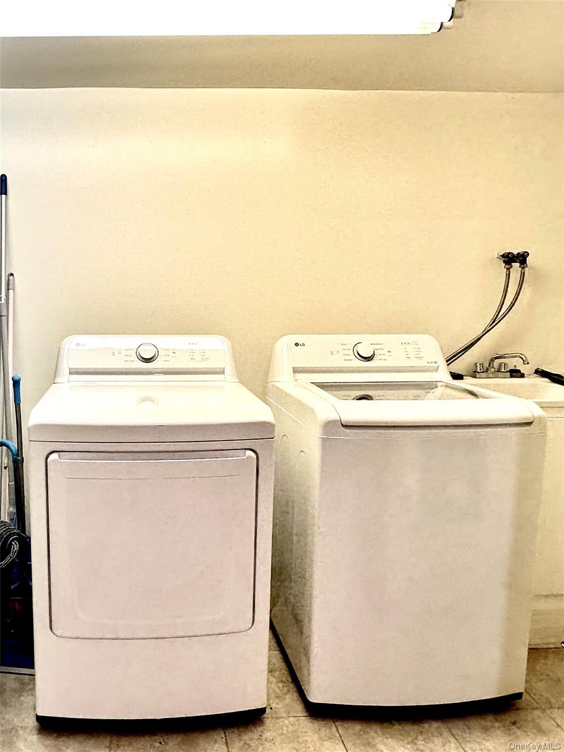 1027 Windermere Road Franklin Square, NY 11010 - Photo 35 of 43 a utility room with dryer and washer