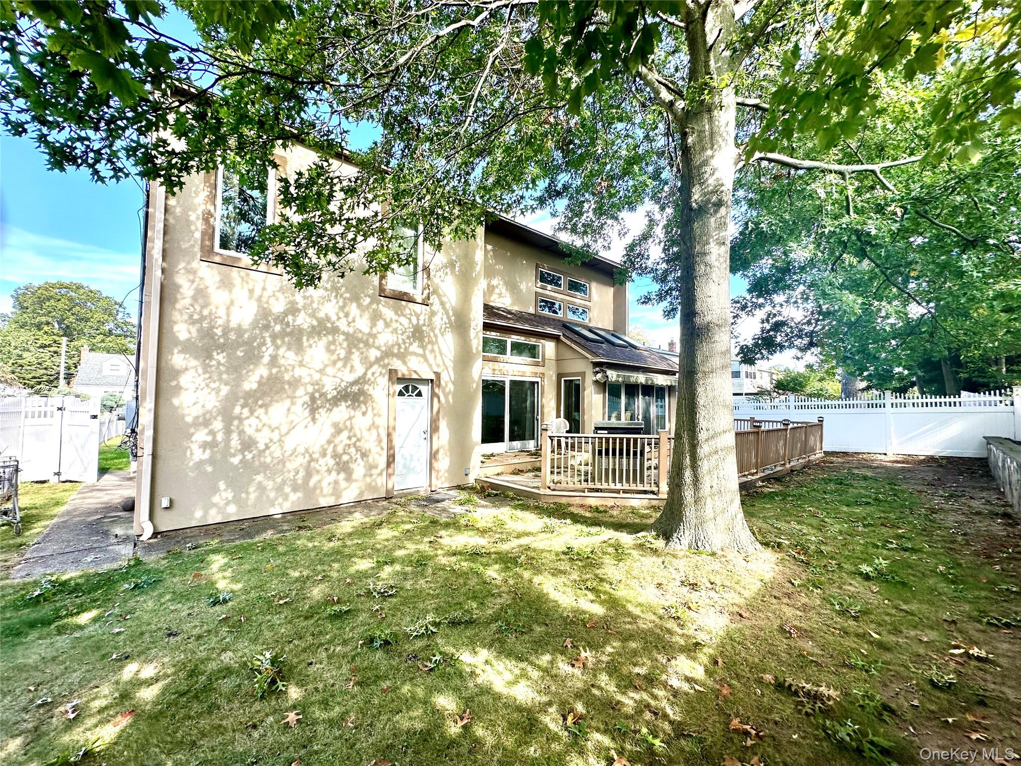 1027 Windermere Road Franklin Square, NY 11010 - Photo 42 of 43 a backyard of a house with lots of green space