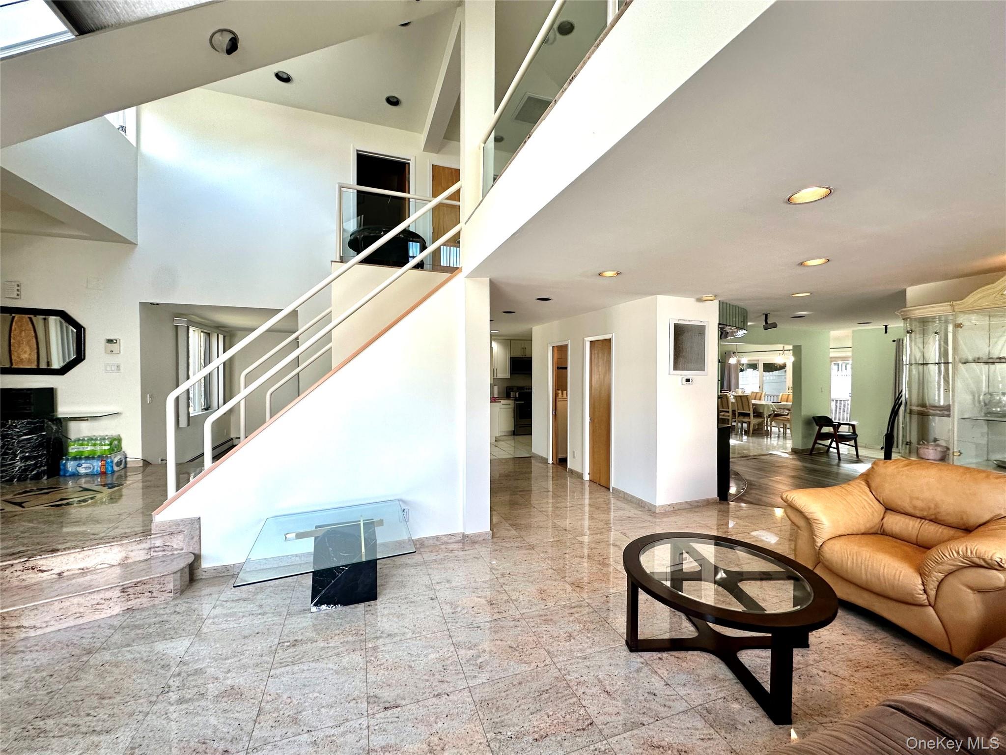 1027 Windermere Road Franklin Square, NY 11010 - Photo 10 of 43 a living room with furniture and white walls