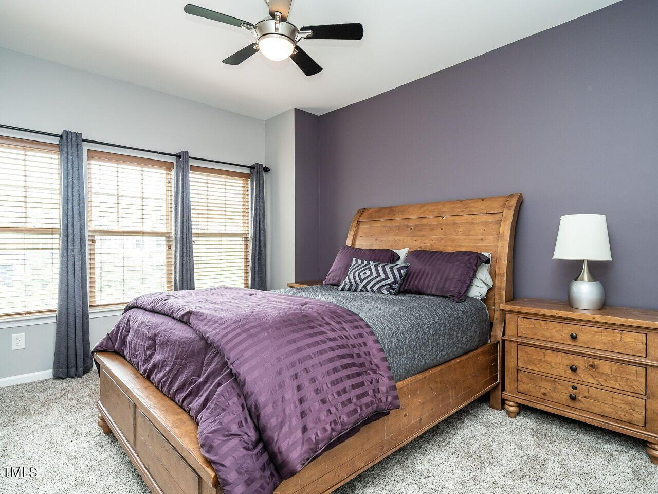 1316 Cornell Place Raleigh, NC 27607 - Photo 21 of 31 a bed sitting in a bedroom next to a window