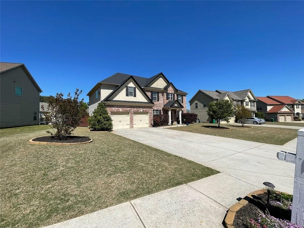 a front view of a house with a yard