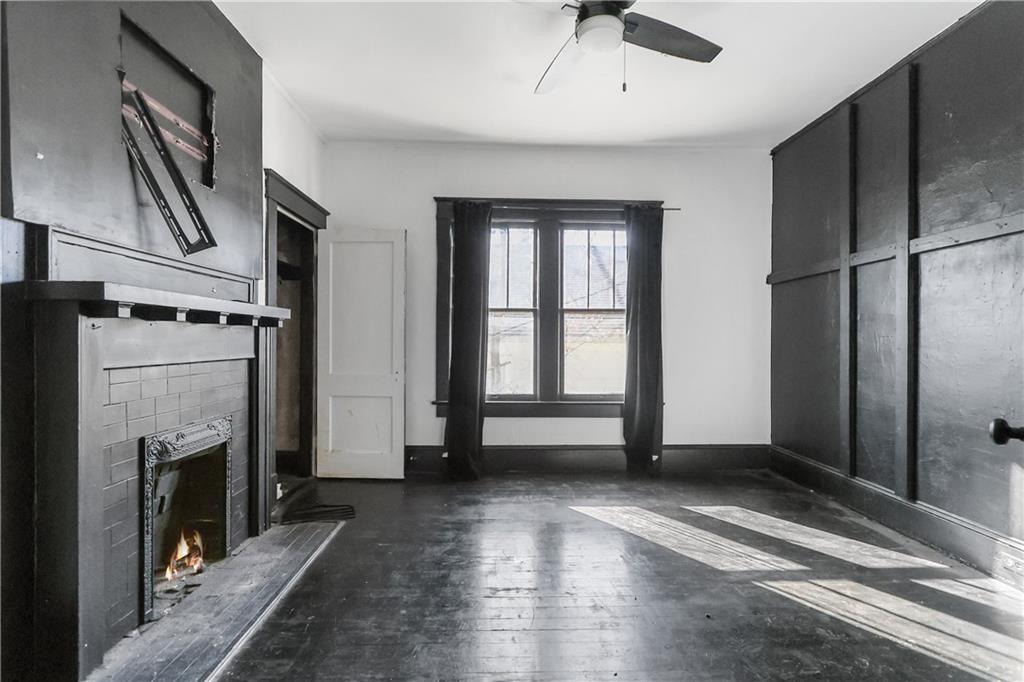 1329 Allene Avenue Southwest Atlanta, GA 30310 - Photo 11 of 20 a view of empty room with floor fireplace and window