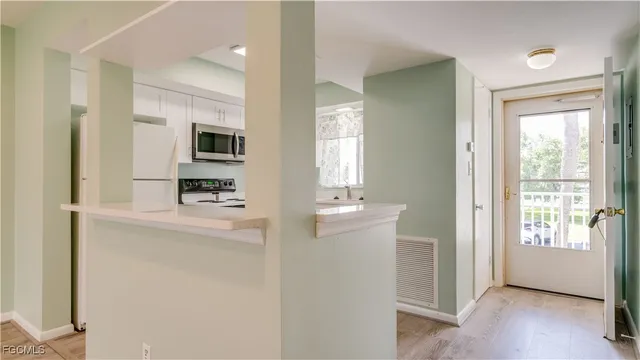 a view of kitchen with livingroom