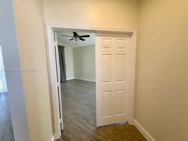 a bathroom with a double vanity sink a toilet and shower