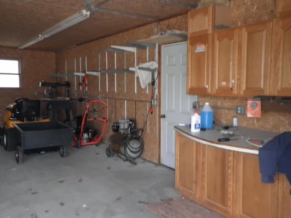 a kitchen with stainless steel appliances granite countertop a sink a refrigerator and a stove