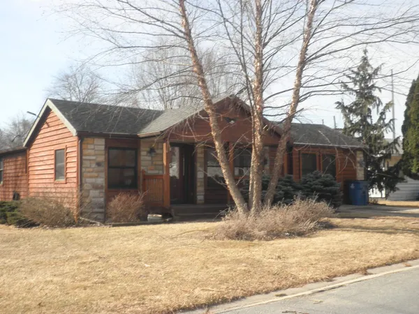 a front view of house with a yard