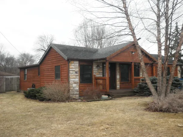 a front view of a house with garage