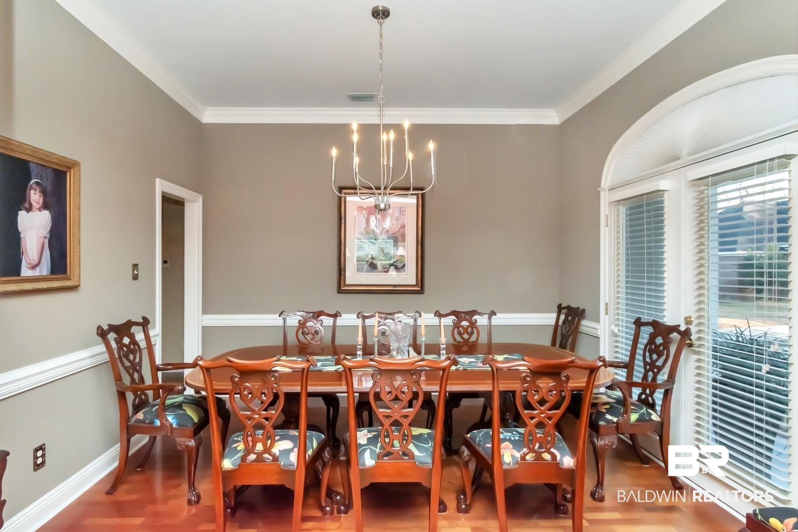 1050 Southern Way Court Mobile, AL 36609 - Photo 3 of 36 Dining space featuring an inviting chandelier, ornamental molding, and hardwood / wood-style flooring
