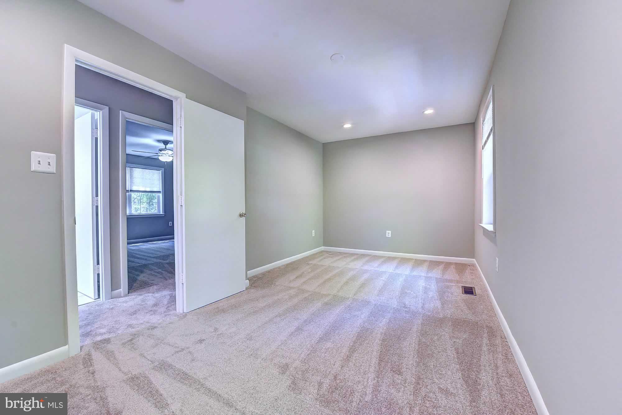 2226 Gunsmith Square Reston, VA 20191 - Photo 31 of 35 wooden floor in an empty room with a window