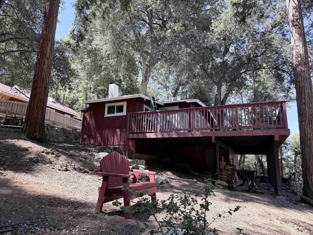 22292 Crestline Road Palomar Mountain, CA 92060 - Photo 17 of 38 a front view of a house with garden and patio