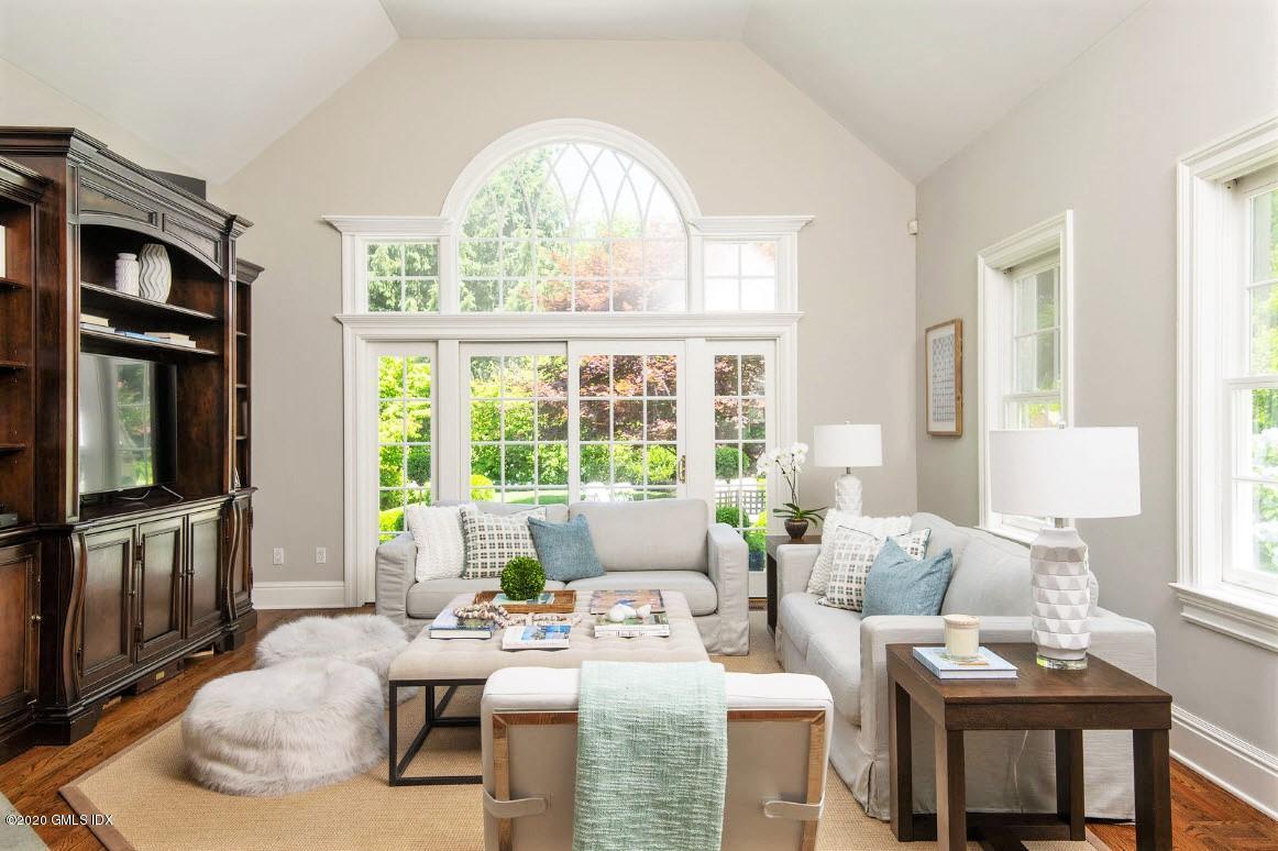 123 Valley Drive Greenwich, CT 06831 - Photo 15 of 48 a living room with furniture large window and wooden floor